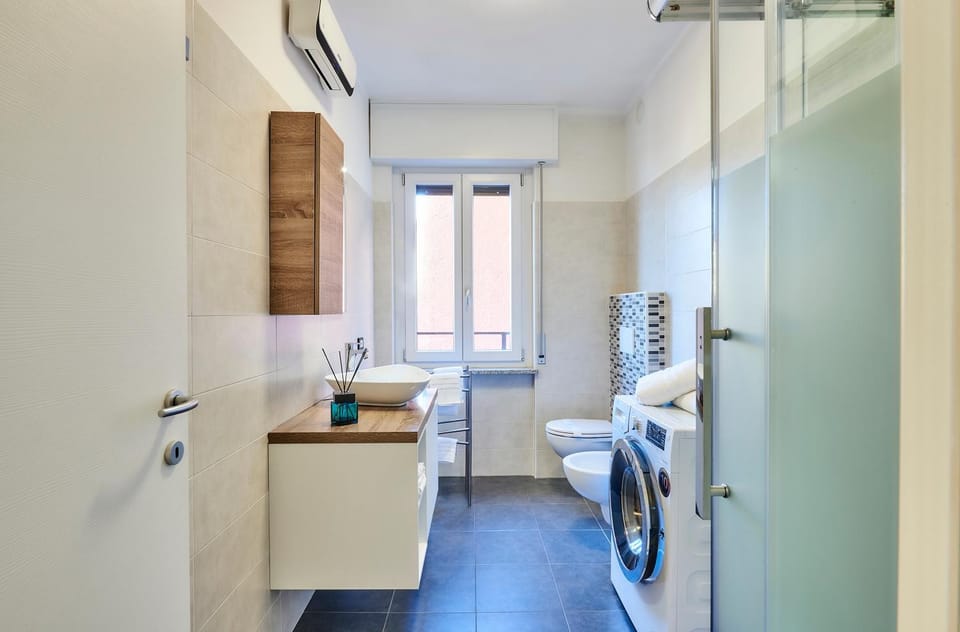 Bathroom, Lake view, towels, washing machine, air conditioner