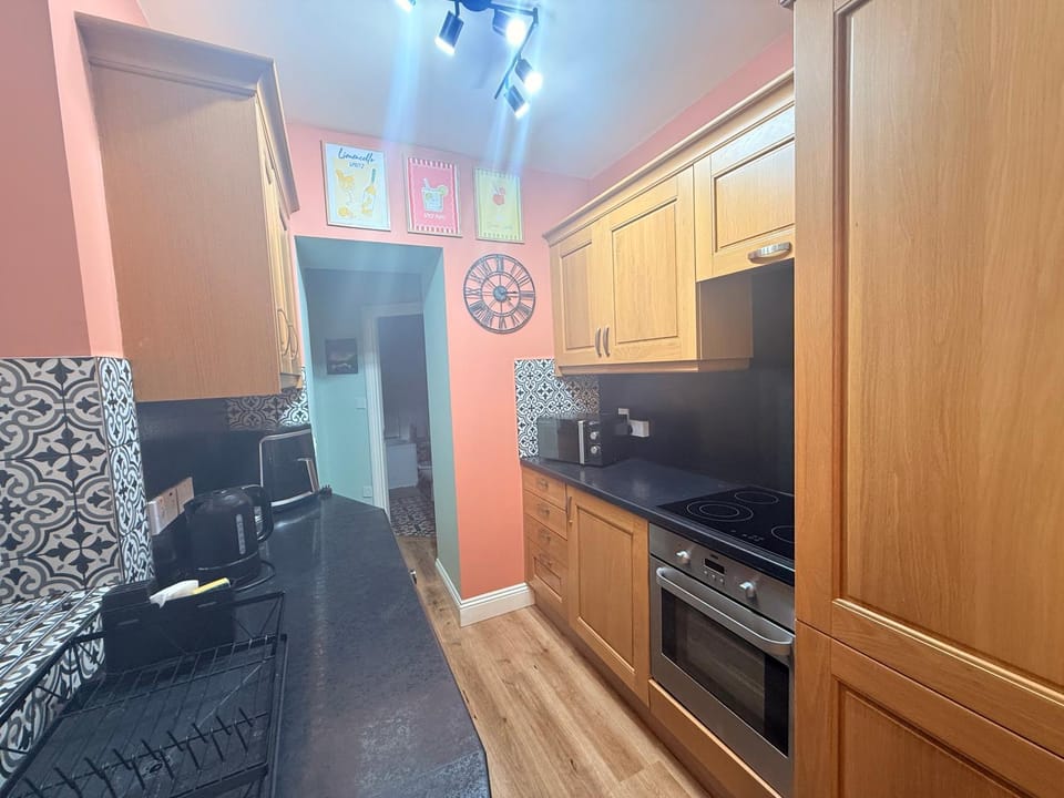 Kitchen or kitchenette, microwave, oven, stove