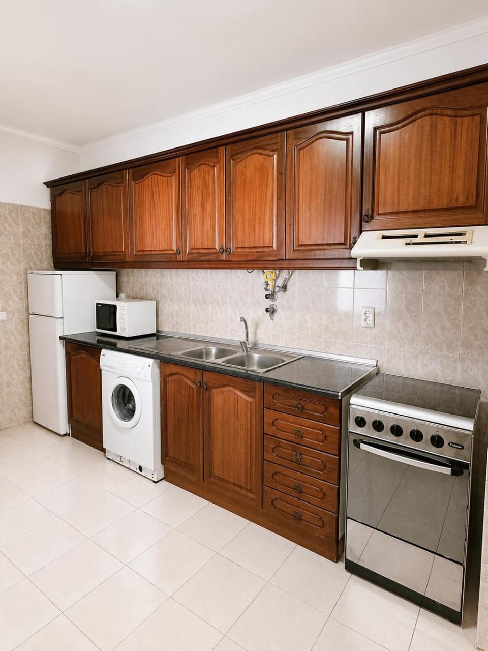 Kitchen or kitchenette, oven, stove, washing machine