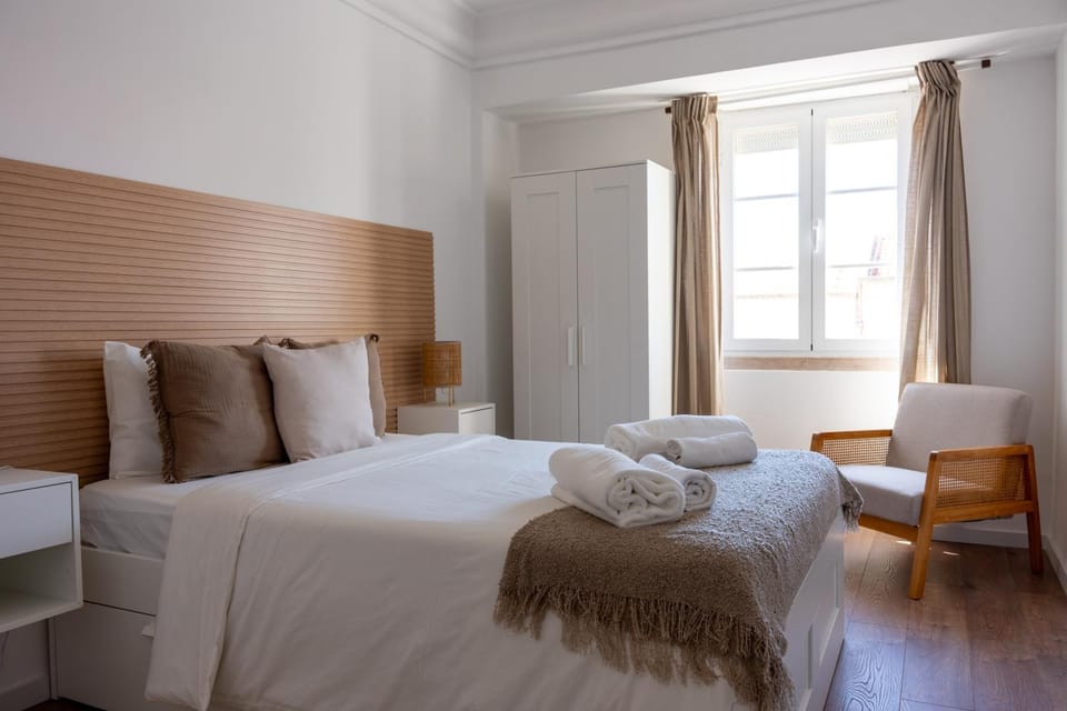 Bed, Photo of the whole room, Decorative detail, Bedroom, towels, wardrobe, air conditioner