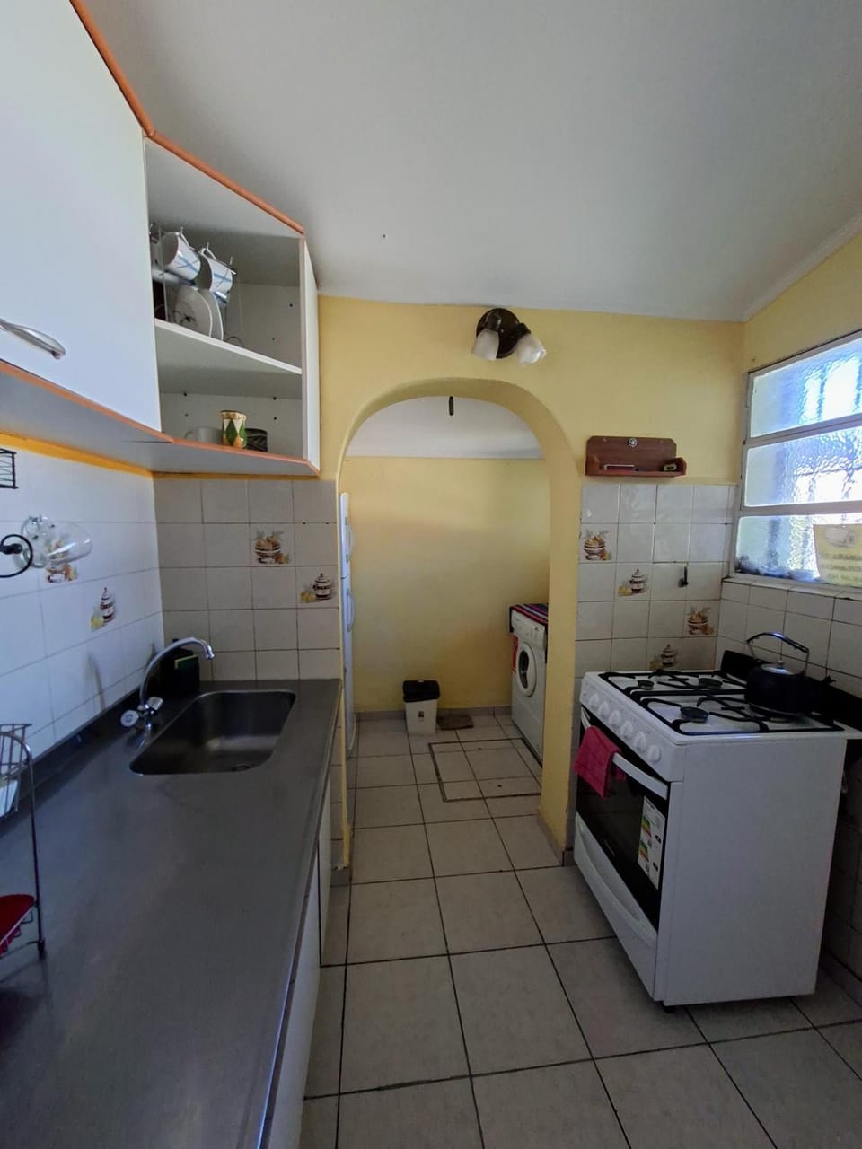 Kitchen or kitchenette, oven, stove, washing machine