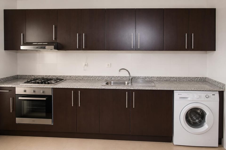 Kitchen or kitchenette, stove, washing machine