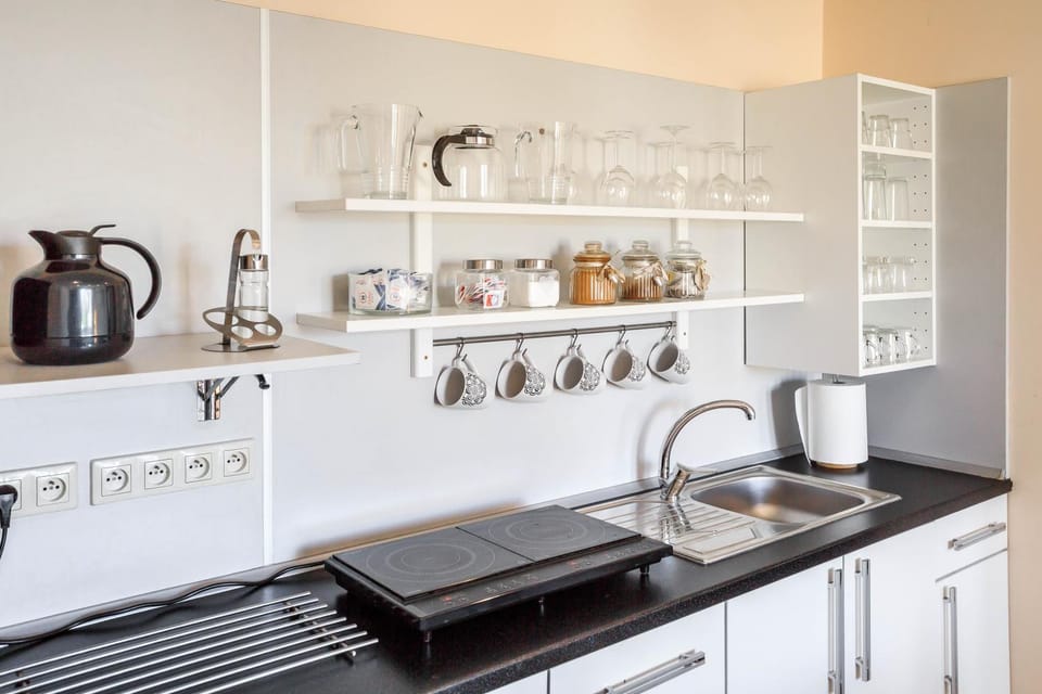 Property building, People, Activities, Coffee/tea facilities, View (from property/room), Kitchen or kitchenette, Food and drinks, Food and drinks, Communal kitchen, Area and facilities