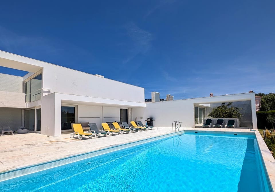 Property building, Patio, Pool view, Swimming pool, sunbed