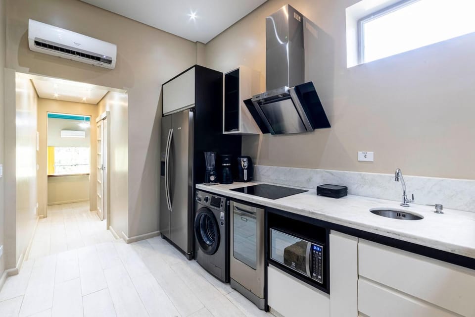 Kitchen or kitchenette, dishwasher, stove, air conditioner