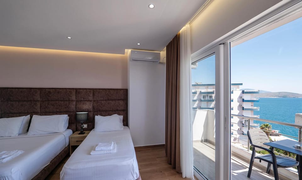 Bed, Natural landscape, View (from property/room), Balcony/Terrace, Living room, Photo of the whole room, Seating area, Bedroom, Sea view, air conditioner