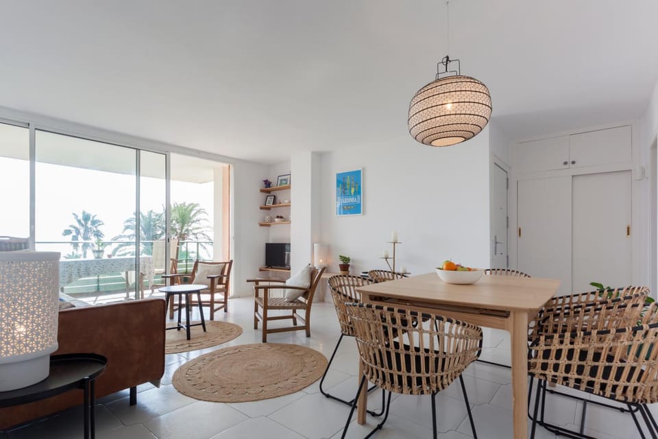 Property building, Living room, Lounge or bar, Dining area, Beach