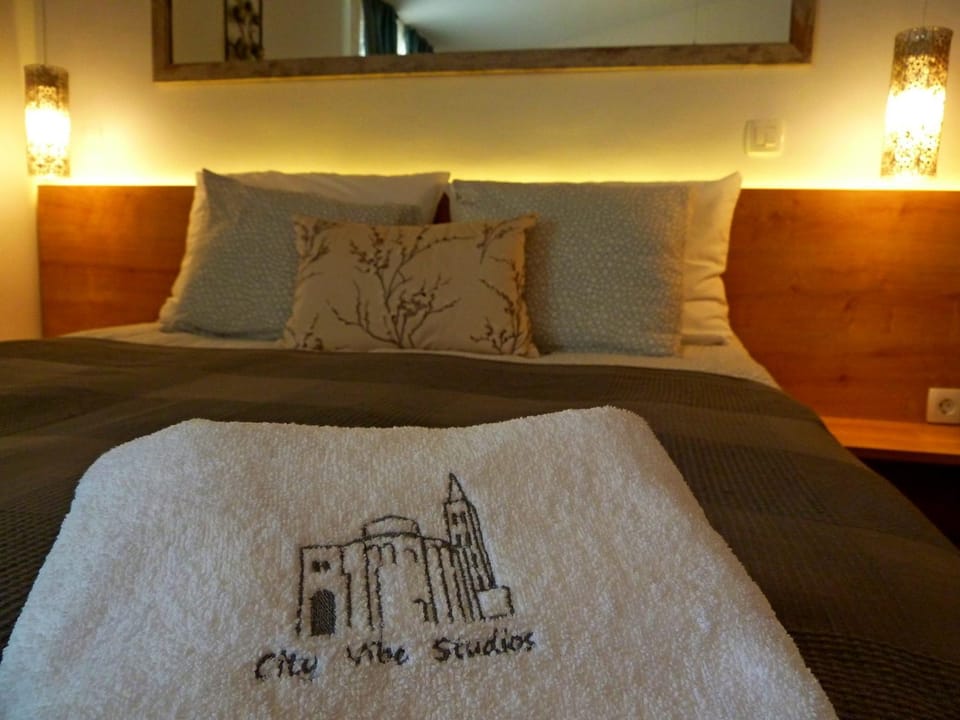 Bed, Property logo or sign, Decorative detail, Bedroom