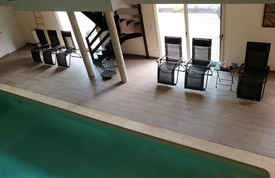 Property building, Living room, Seating area, Garden view, Garden view, Pool view, Pool view, Swimming pool, Entertainment, Entertainment, sunbed