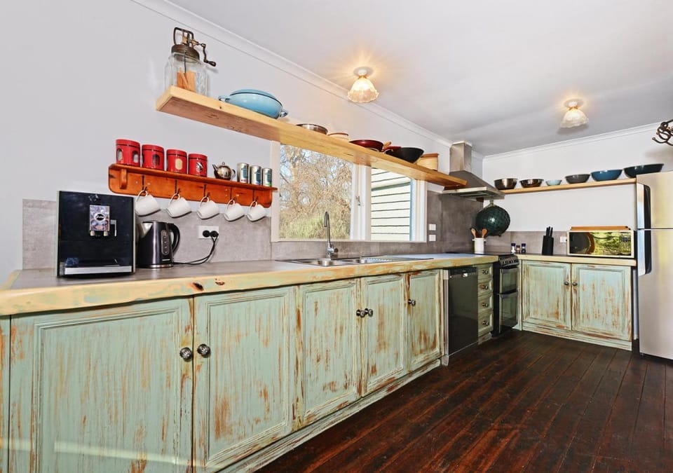 Kitchen or kitchenette, dishwasher, oven, stove