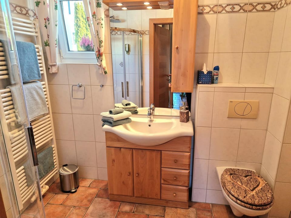 Shower, Toilet, Bathroom, hair dryier, towels