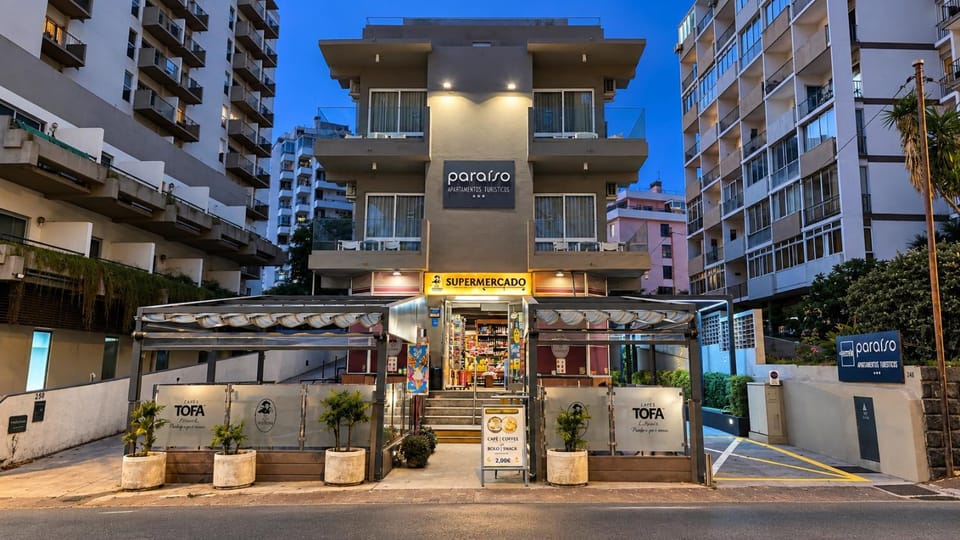Property building, Facade/entrance, Off site, Night, On-site shops, View (from property/room), Autumn, On site, Street view, Supermarket/grocery shop, Location