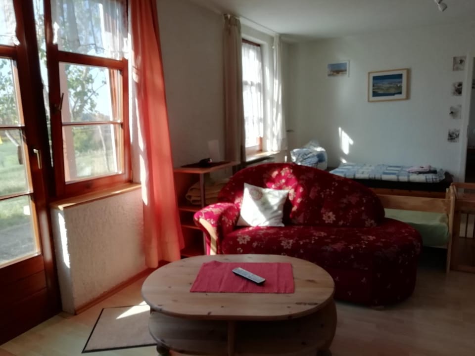 Bed, Living room, Seating area, Bedroom