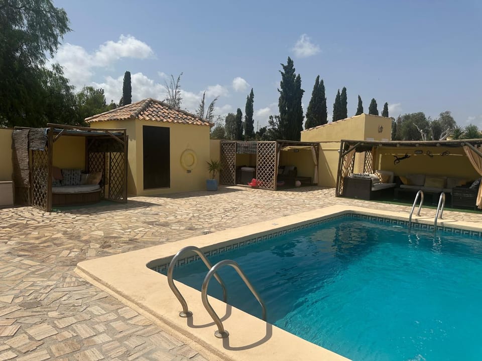 Property building, Patio, Pool view, Swimming pool, sunbed