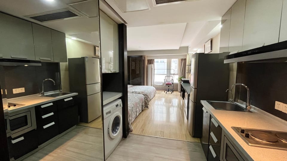 Kitchen or kitchenette, stove, washing machine, dryer
