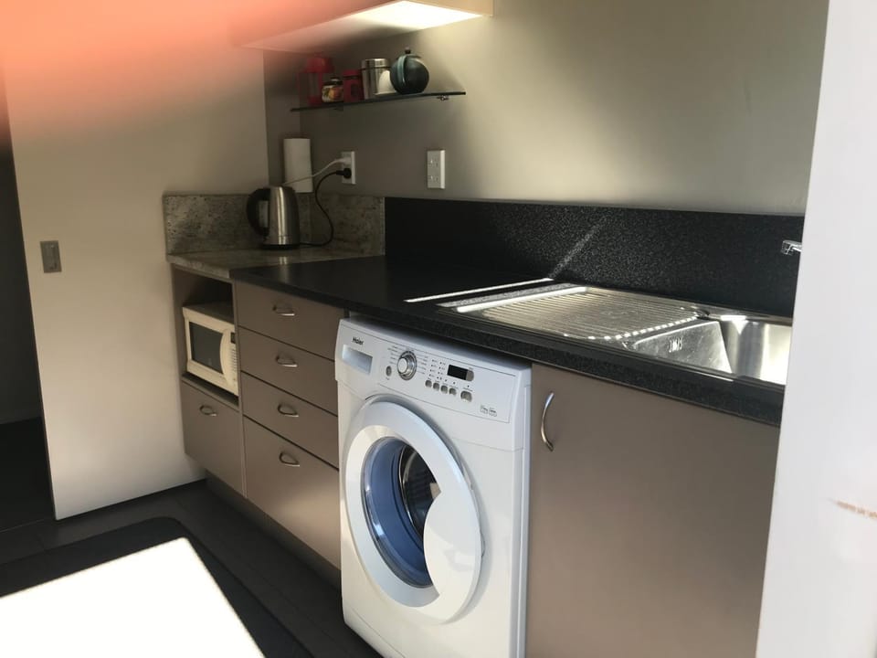 Kitchen or kitchenette, stove, washing machine