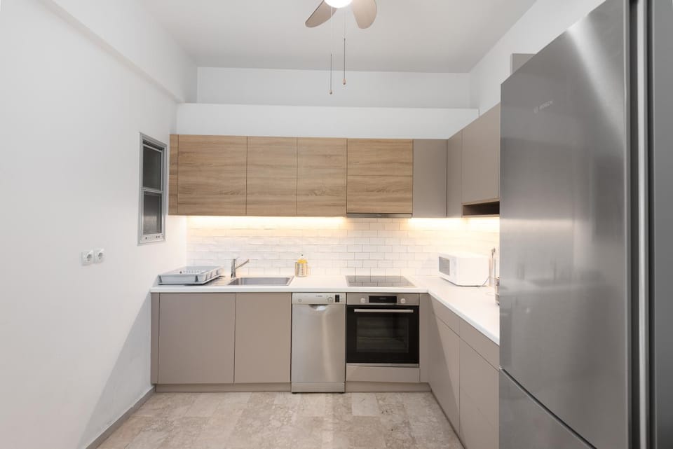 Kitchen or kitchenette, dishwasher, microwave, oven, stove