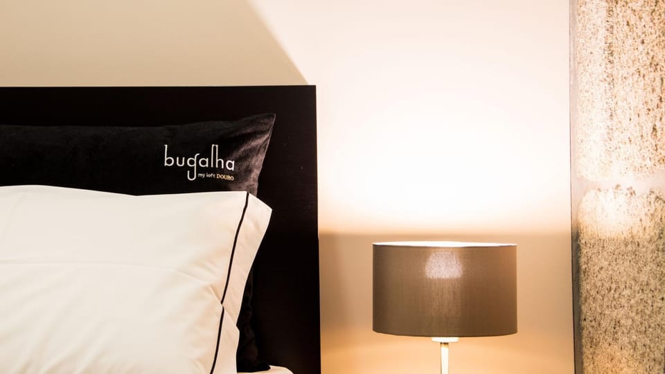 Bed, Property logo or sign, Property logo or sign, Bedroom