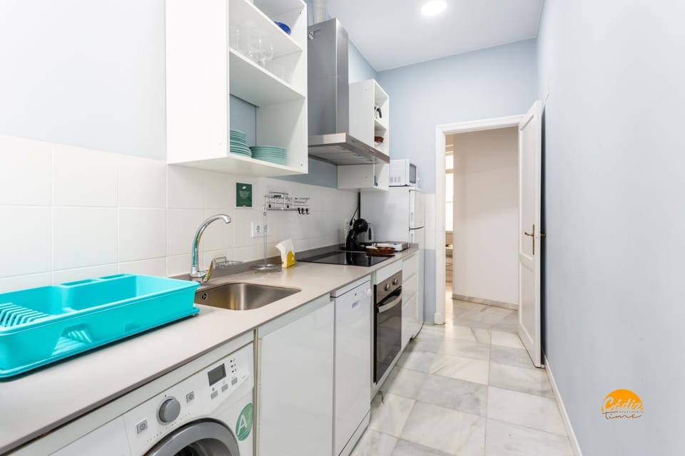 Kitchen or kitchenette, dishwasher, microwave, oven, stove, washing machine