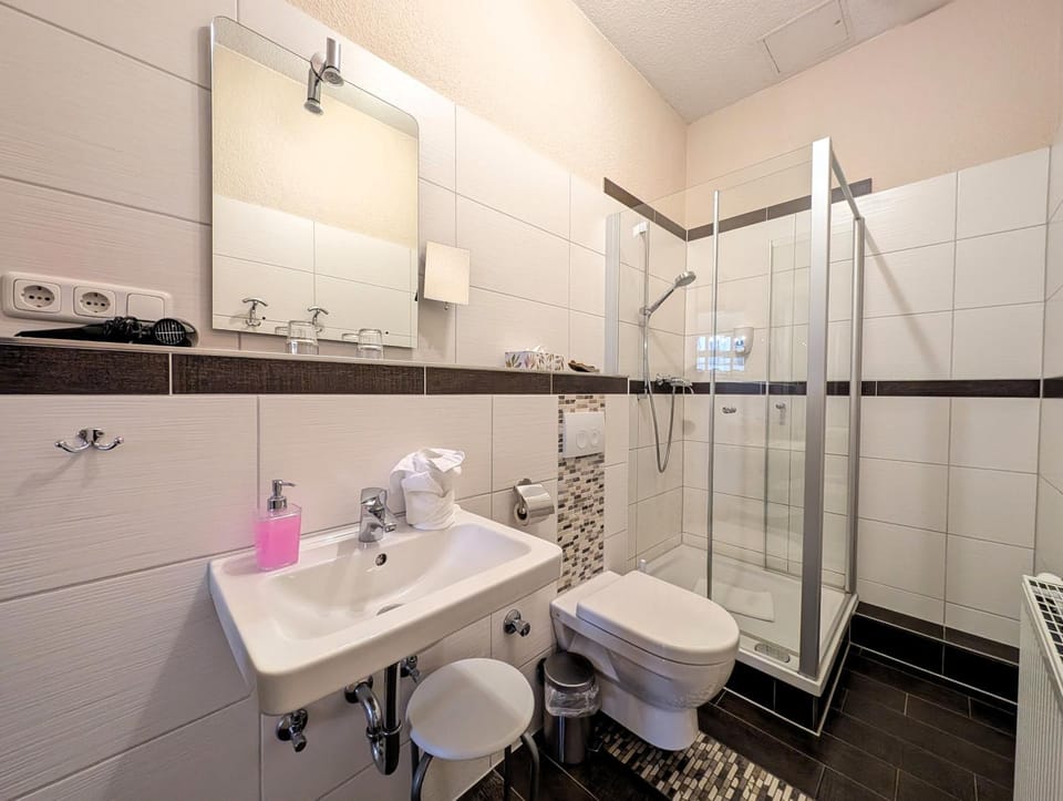 Shower, Toilet, Bathroom, hair dryier, towels