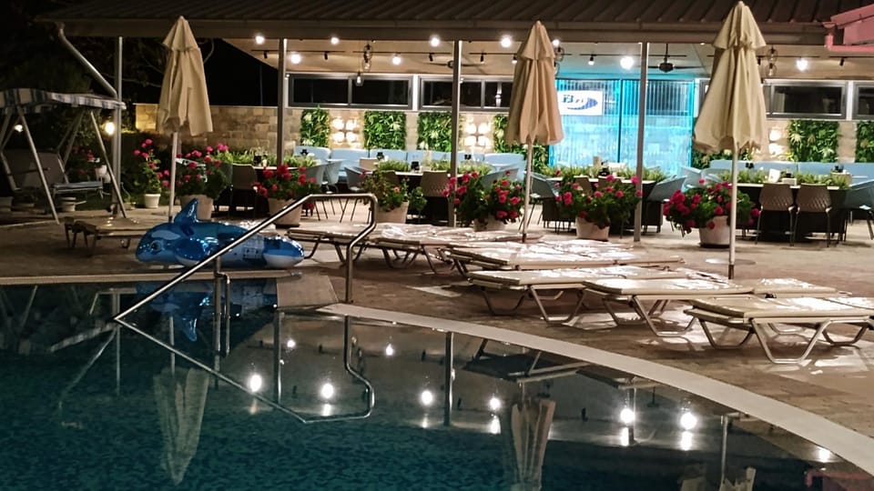 Property building, Restaurant/places to eat, Garden, Swimming pool
