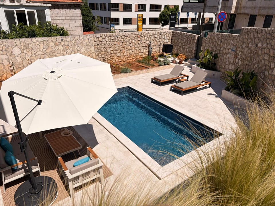 Patio, Day, Pool view, Swimming pool, sunbed