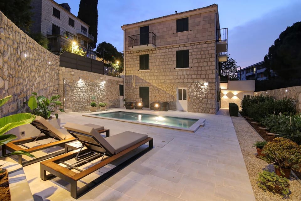 Property building, Patio, Night, Pool view, sunbed
