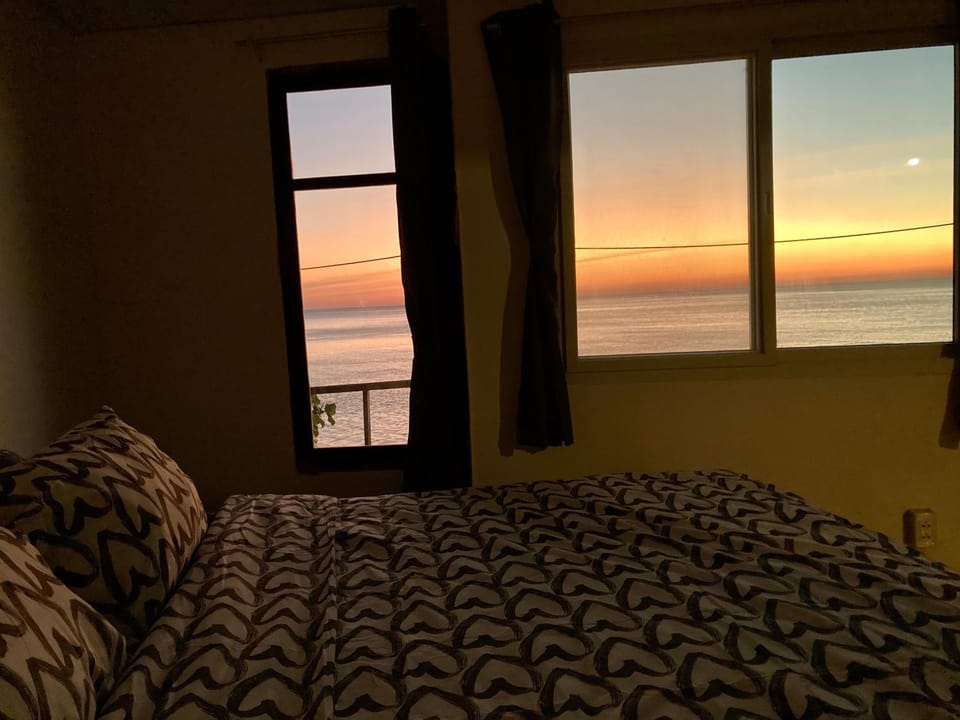 Bed, Natural landscape, Bedroom, Sea view, Sunset