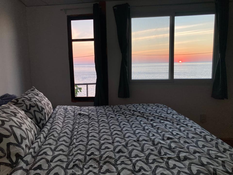 Bed, Natural landscape, Bedroom, Sea view, Sunset