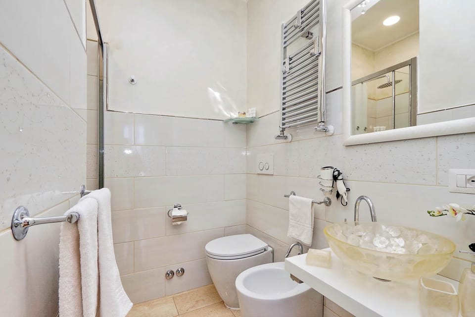 Toilet, Bathroom, bidet, hair dryier, towels