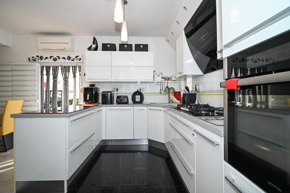 Kitchen or kitchenette, dishwasher, oven, stove, toaster