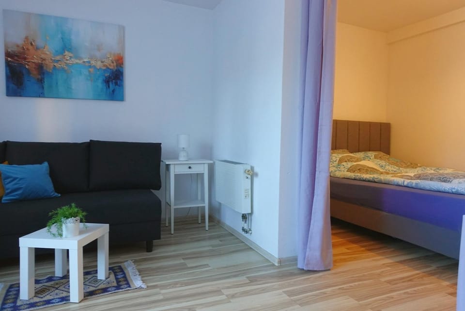 Bed, Living room, Seating area, Bedroom