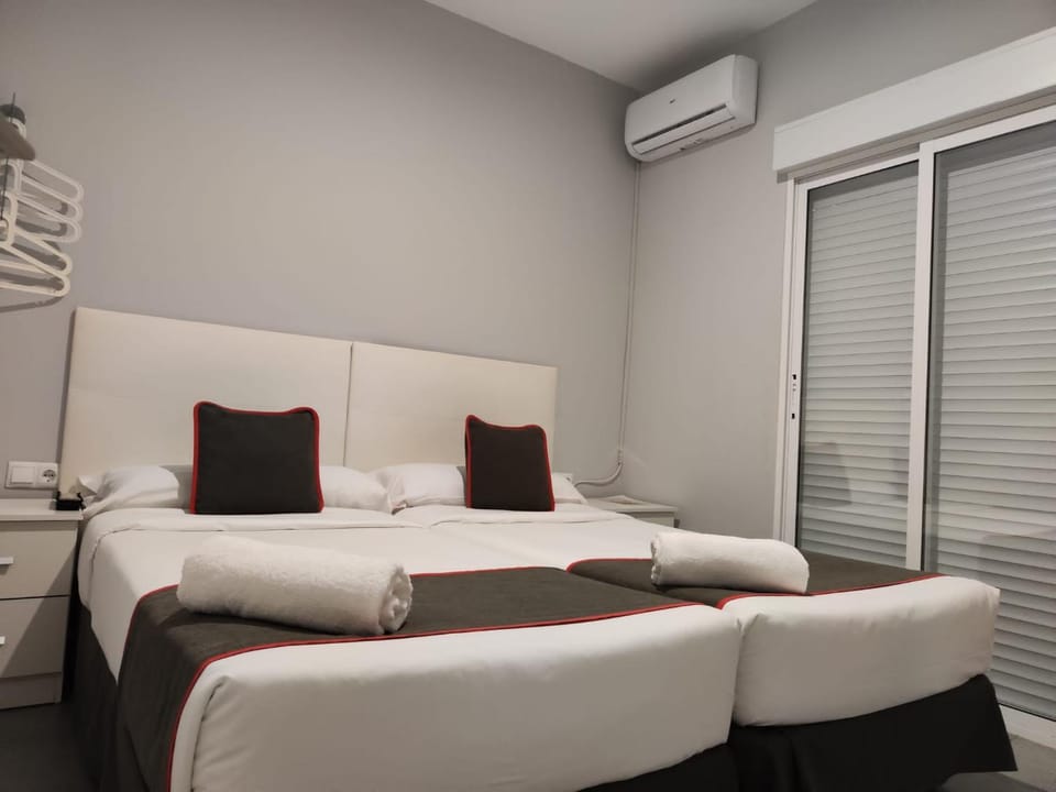 Bed, Photo of the whole room, Bedroom, towels, air conditioner