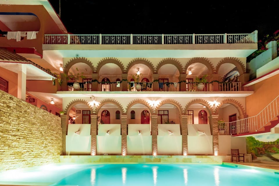 Property building, Patio, Night, Pool view, Swimming pool