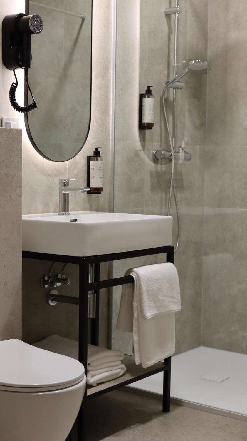 Shower, Toilet, Bathroom, hair dryier, towels