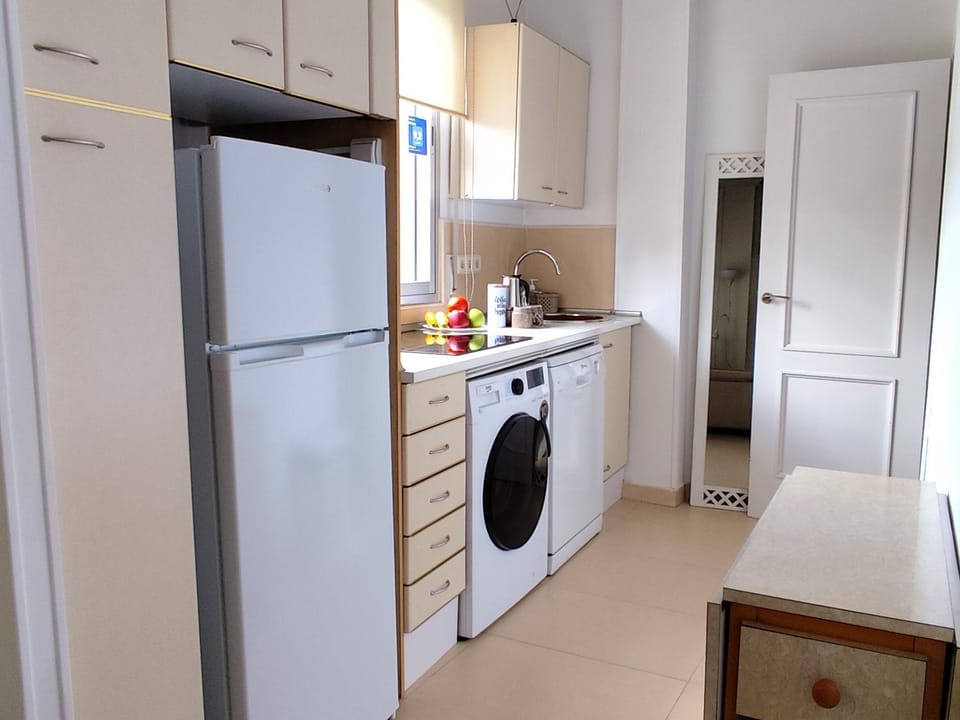 Kitchen or kitchenette, dishwasher, stove, washing machine
