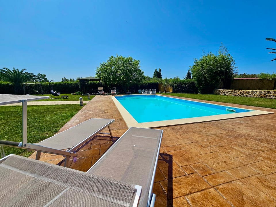 Large Villa Mediterranea in the heart of Coral Shore with swimming pool large garden with palm trees Villa in Sardinia