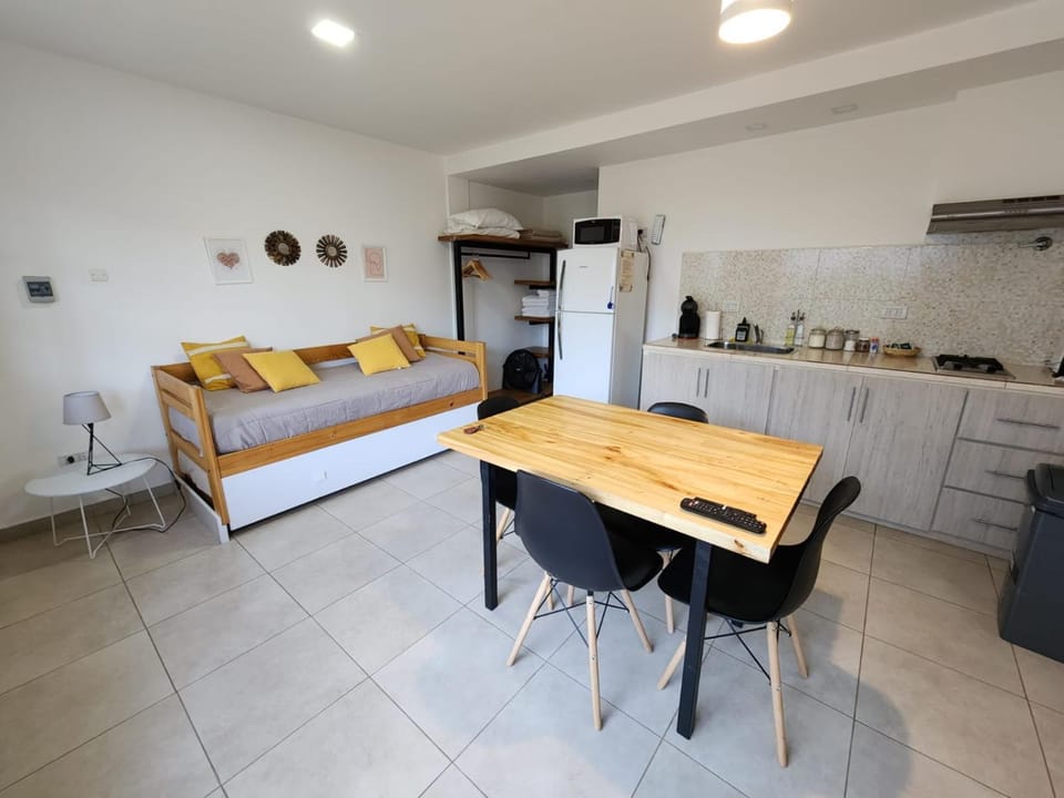 Bed, Kitchen or kitchenette, Seating area