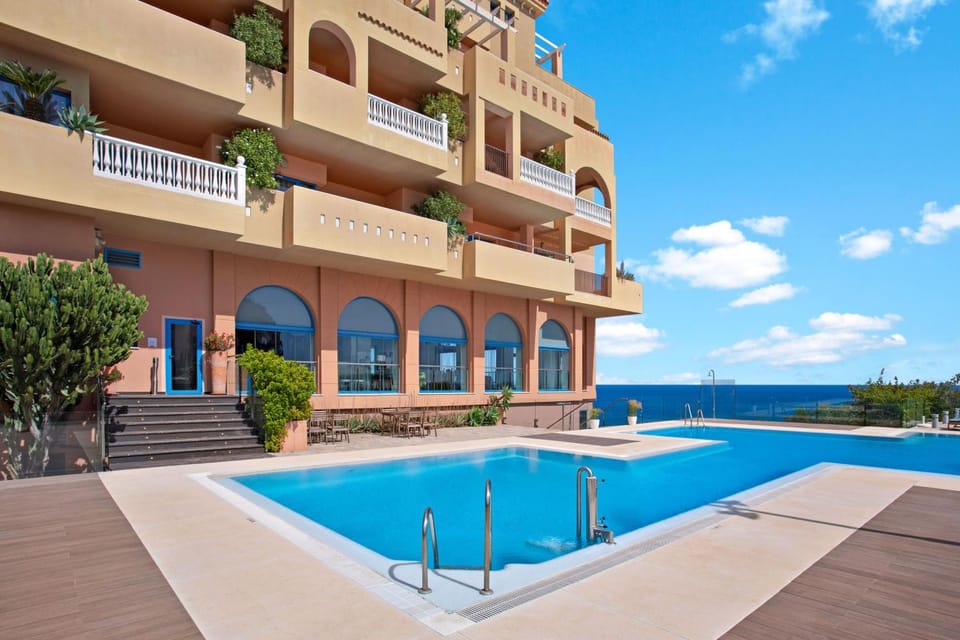 Facade/entrance, View (from property/room), Balcony/Terrace, Dining area, Sea view, Swimming pool