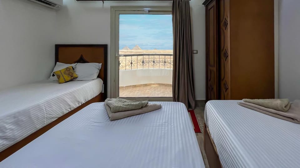 Bed, Photo of the whole room, Bedroom, towels, air conditioner