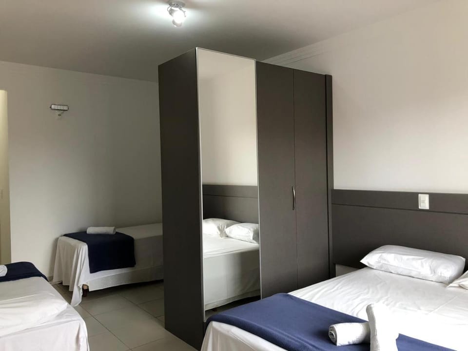 Bed, towels, wardrobe