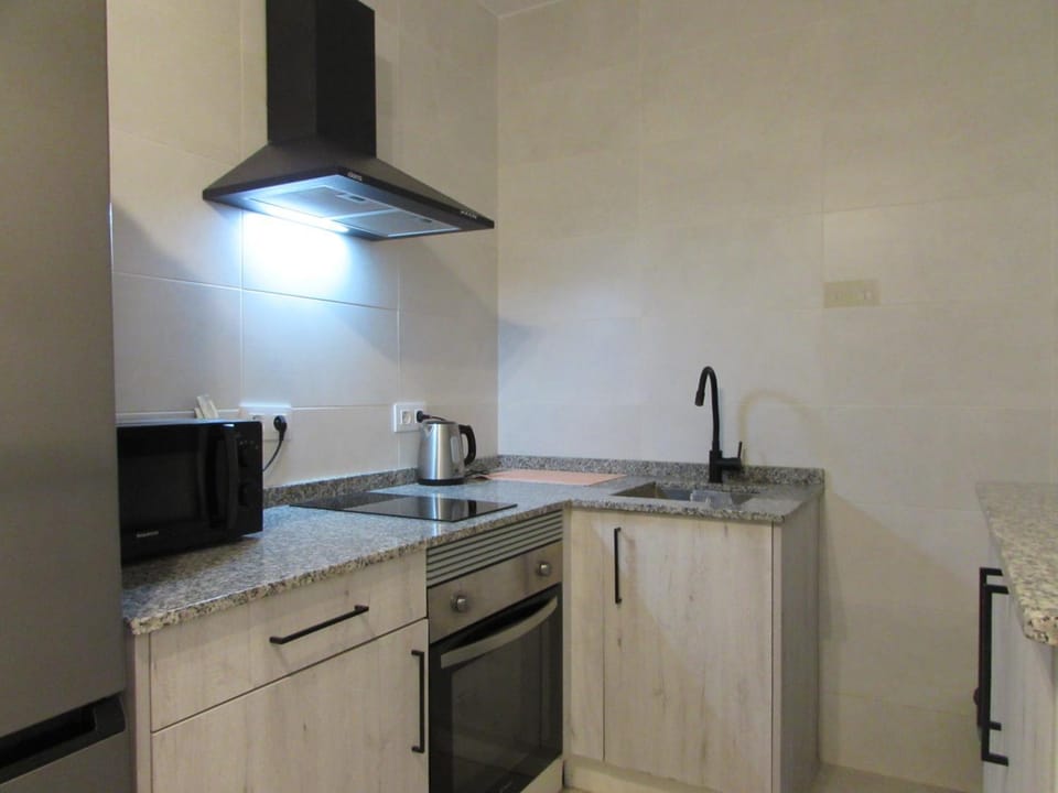 Kitchen or kitchenette, oven