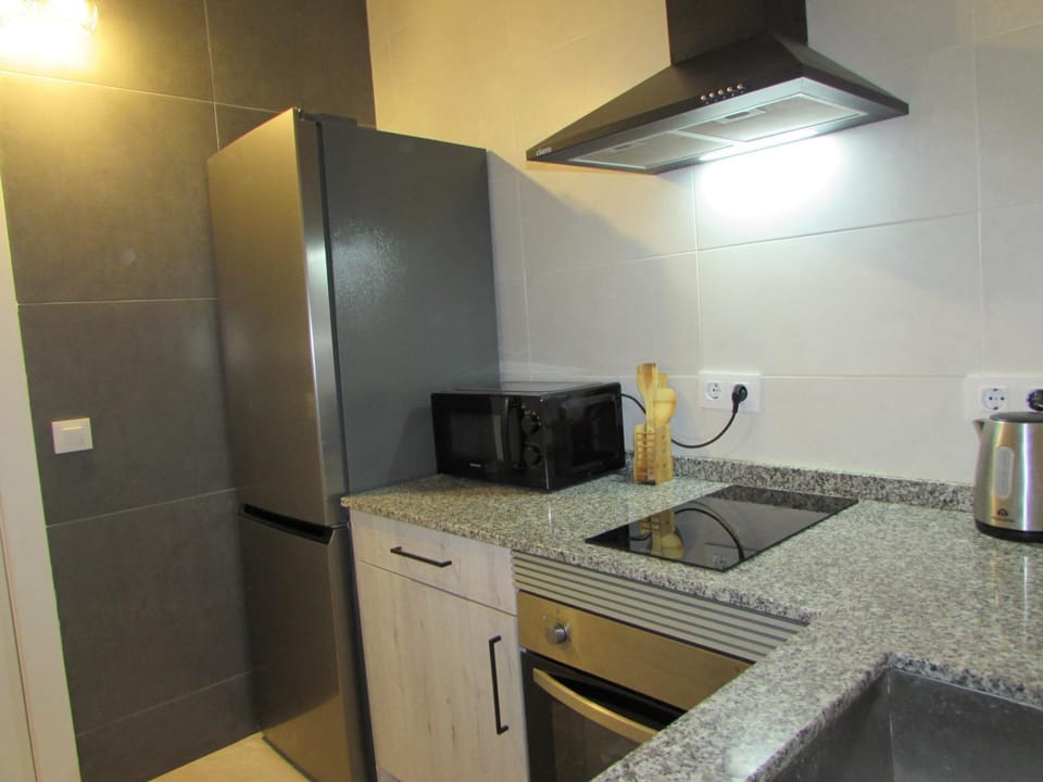 Kitchen or kitchenette, stove