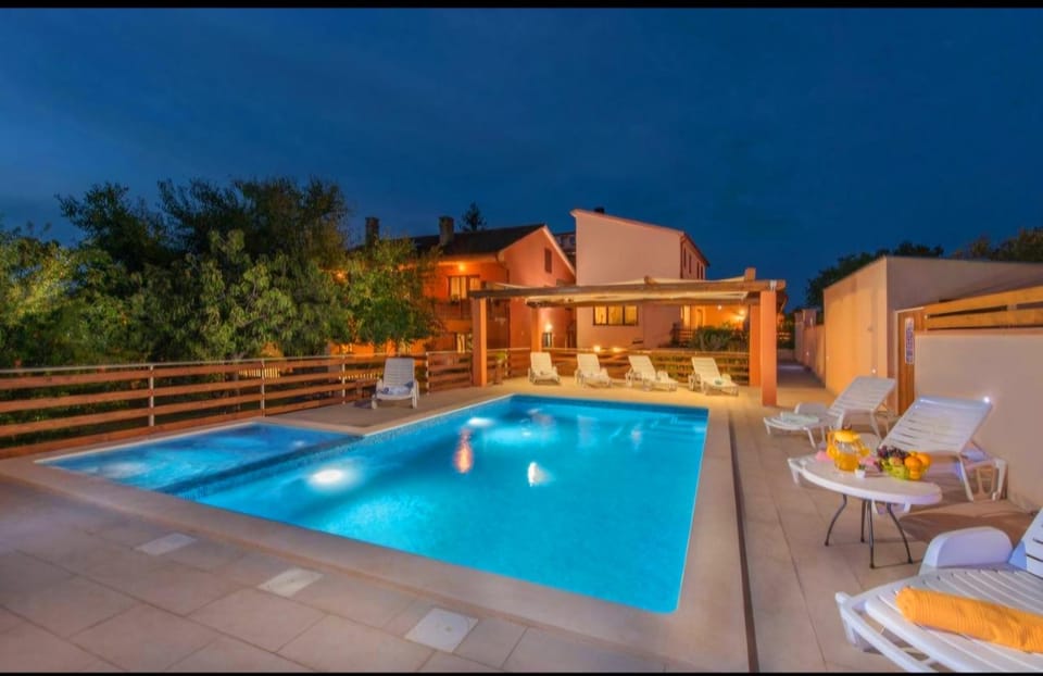 Property building, Night, Natural landscape, Pool view, Swimming pool, sunbed