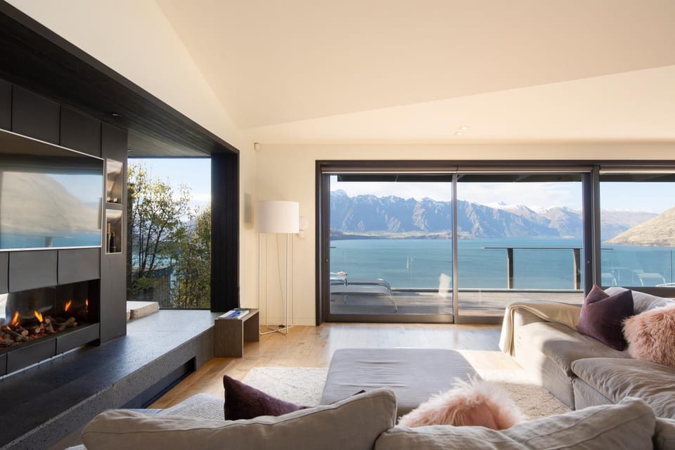 View (from property/room), Balcony/Terrace, Living room, Seating area, Lake view, Mountain view, fireplace
