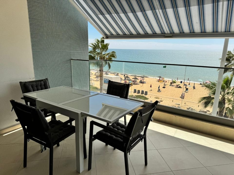 View (from property/room), Balcony/Terrace, Seating area, Beach, Sea view