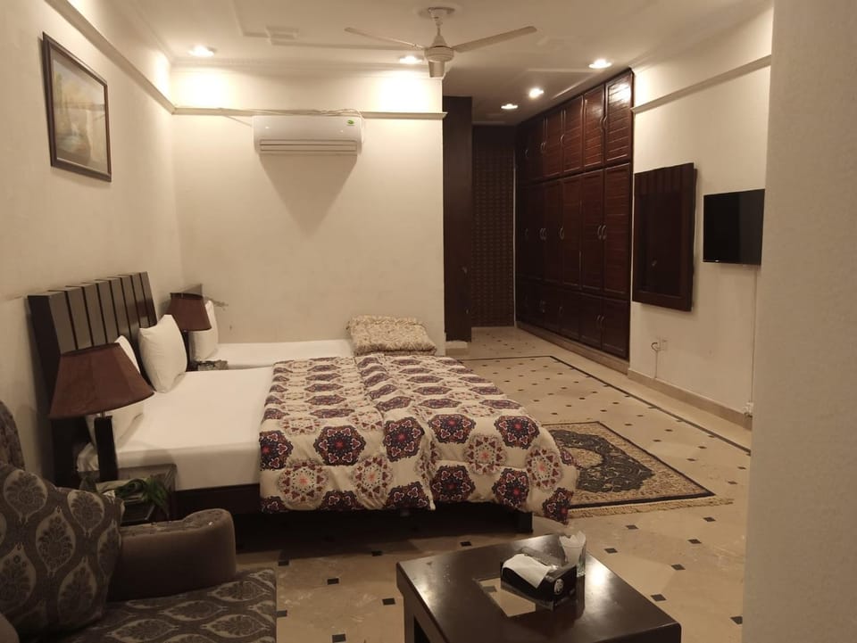 Shower, Toilet, Bed, Asian breakfast, wardrobe, air conditioner