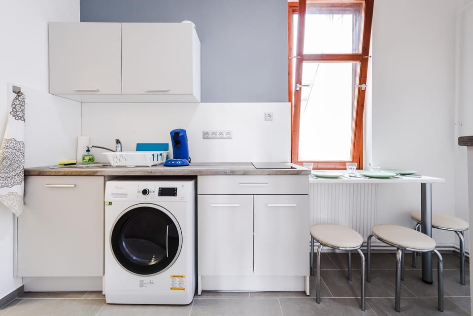 Kitchen or kitchenette, washing machine