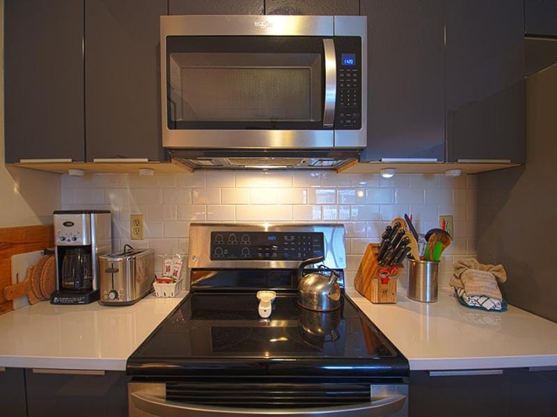 Kitchen or kitchenette, microwave, stove, toaster, kitchen