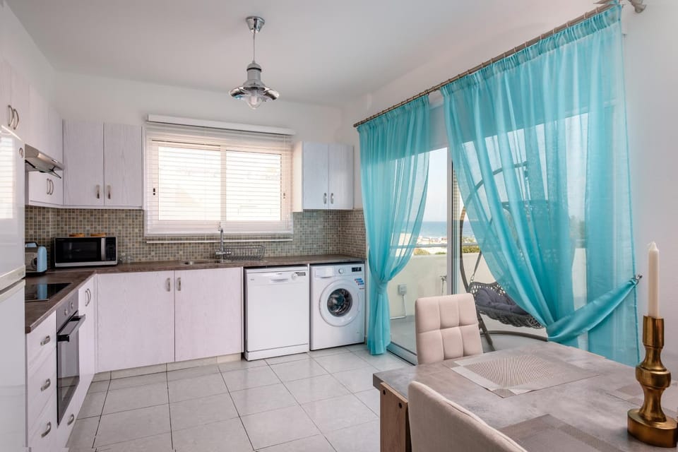 Kitchen or kitchenette, Dining area, dishwasher, stove, washing machine